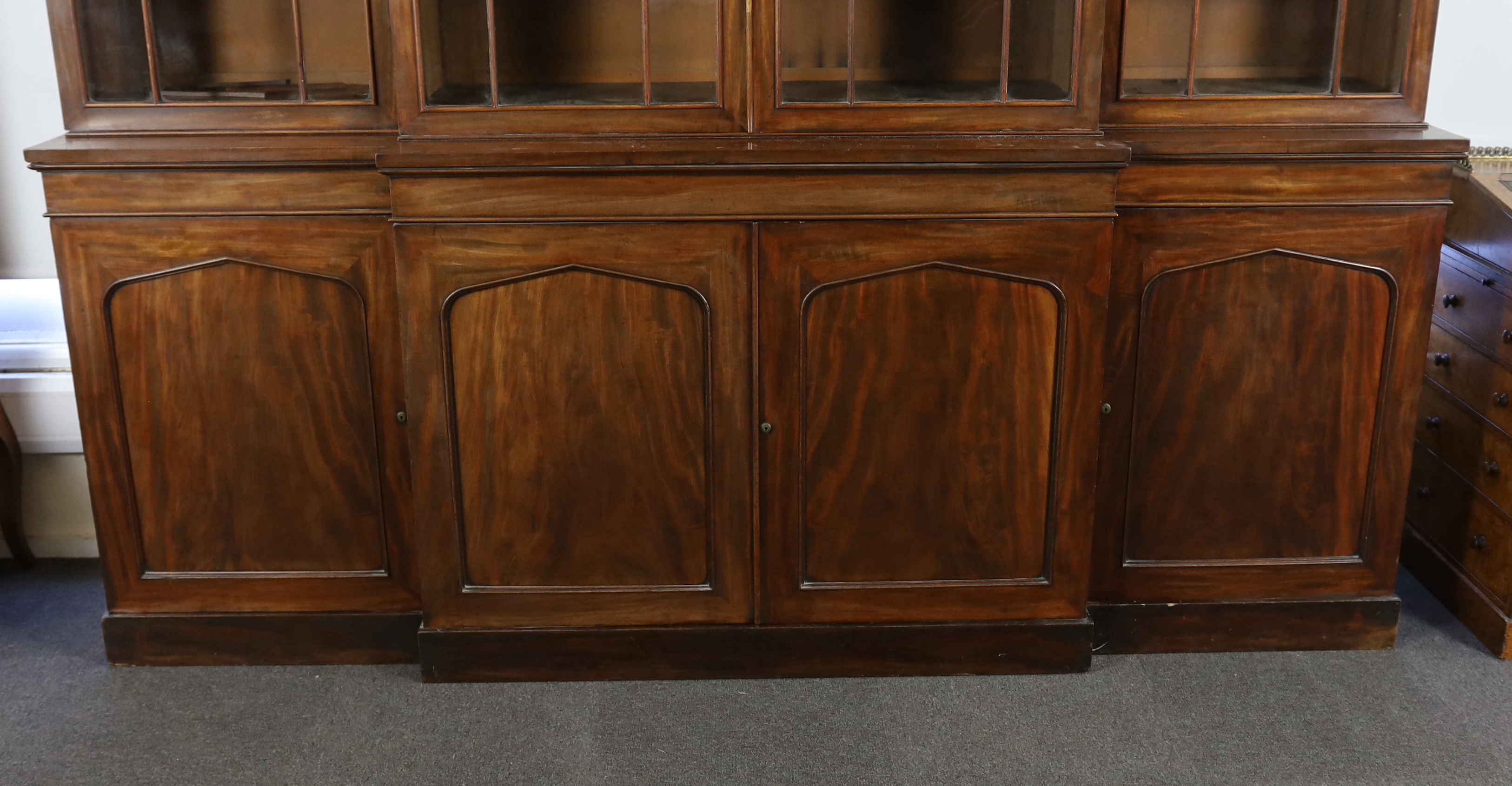 An early Victorian mahogany breakfront library bookcase